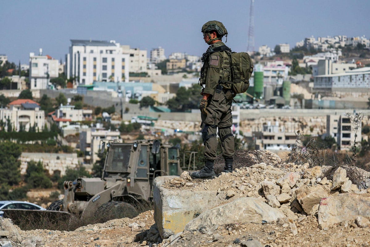 Israeli forces launch raid on Hebron after West Bank shooting attack After two Palestinian assailants killed two…