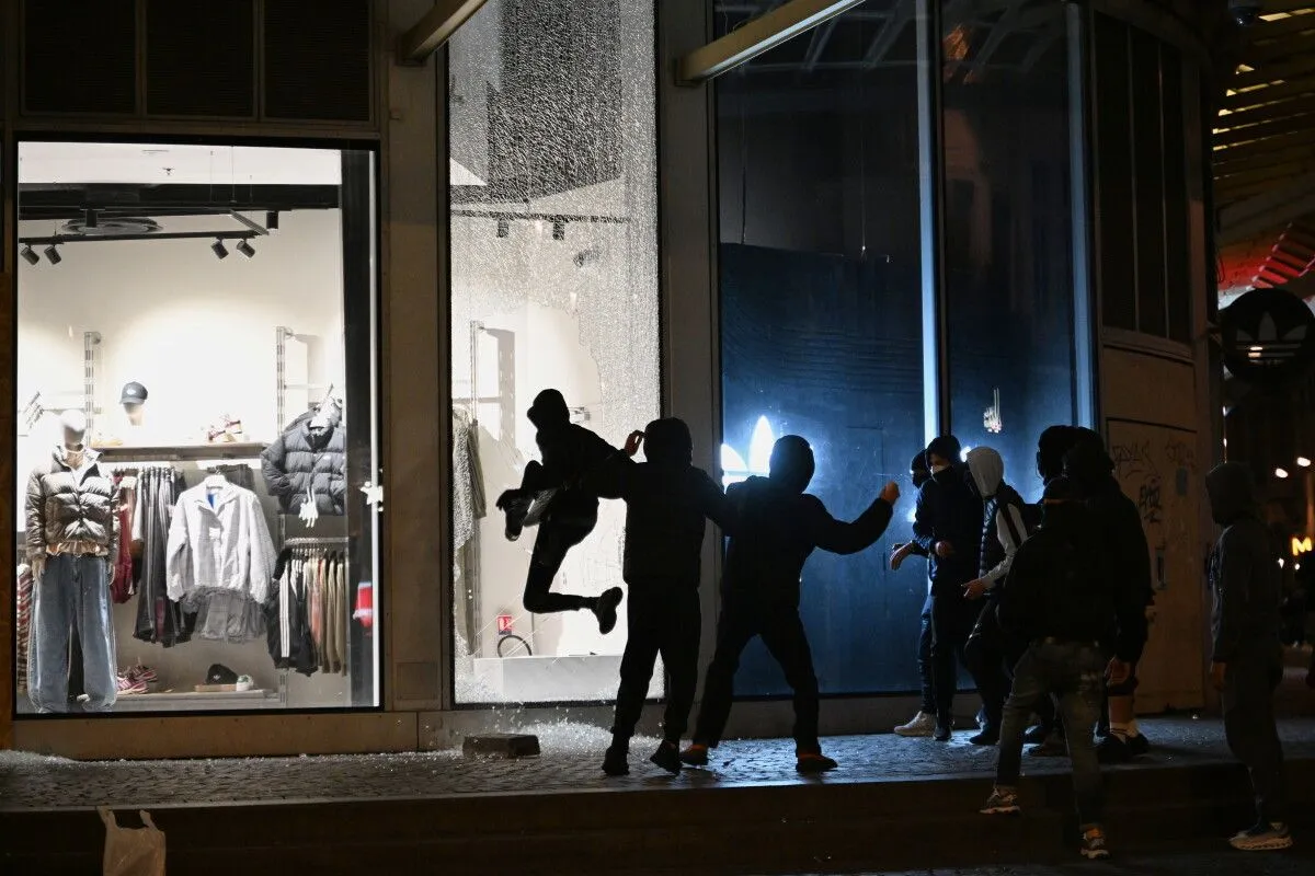 Macron keeps interior minister as France orders local curfews after worst riots in years