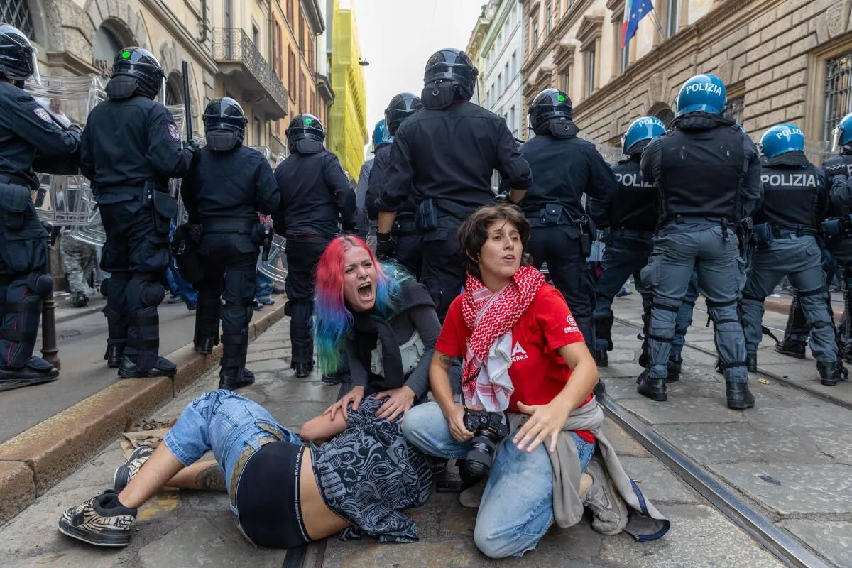 Rioters clashed with police, looted stores and set fires in Milan's main square during a protest against wars and rising