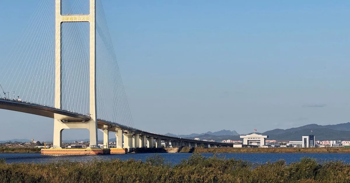 Trucks line up as long-delayed China-North Korea bridge officially opens China and North Korea officially marked the…