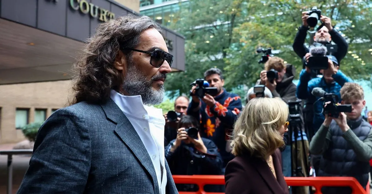 'Wild-eyed' comedian Russell Brand tried to drag me into toilets, woman tells UK court One of six women who accuse…