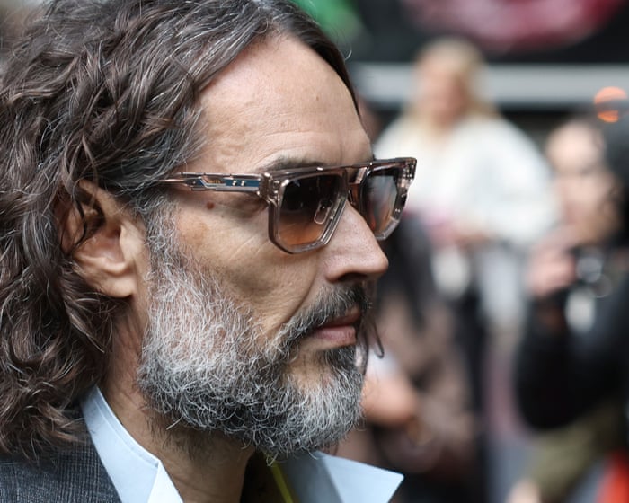 Russell Brand had ‘maniacal grin’ as he dragged woman into toilet and raped her, court told Comedian, who is on trial…